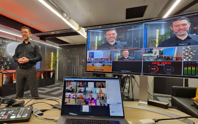 Aaron Garner presenting from the EmotionIntell training studio with screens for remote participants