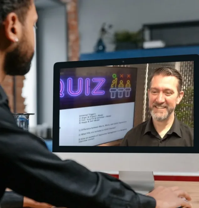 Man being coached in Emotional intelligence Via Computer