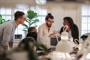 A teach of diverse leaders discussing a project